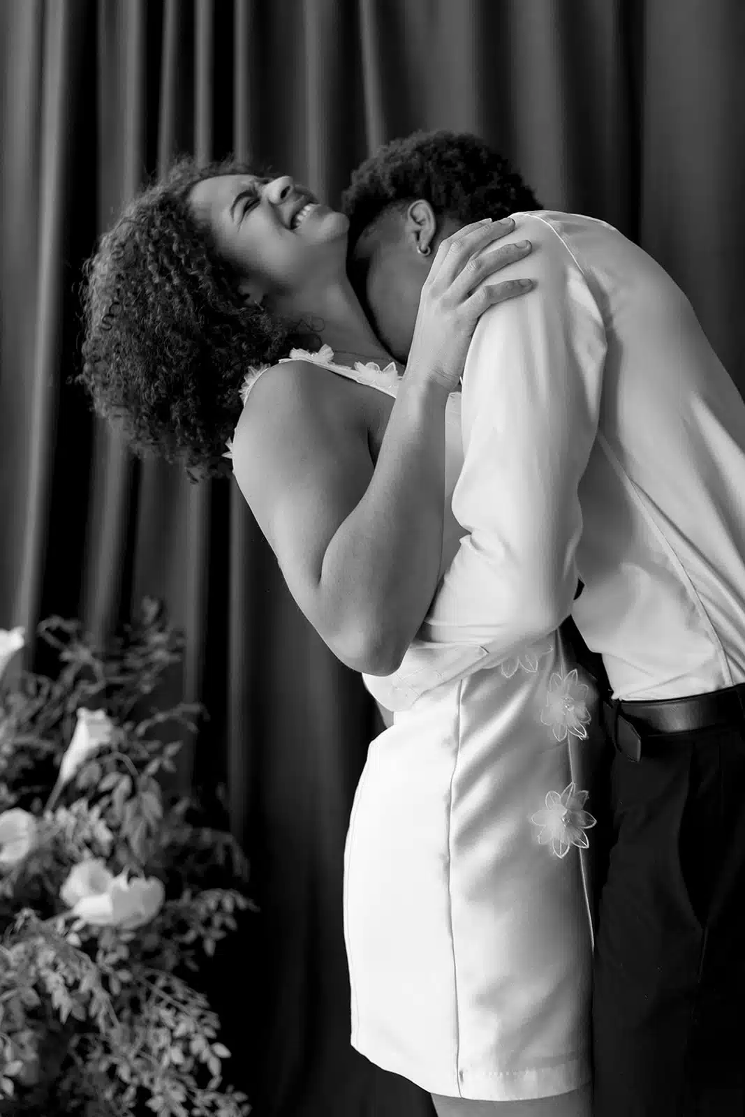Couple embracing in a black-and-white Digital Booth wedding portrait.