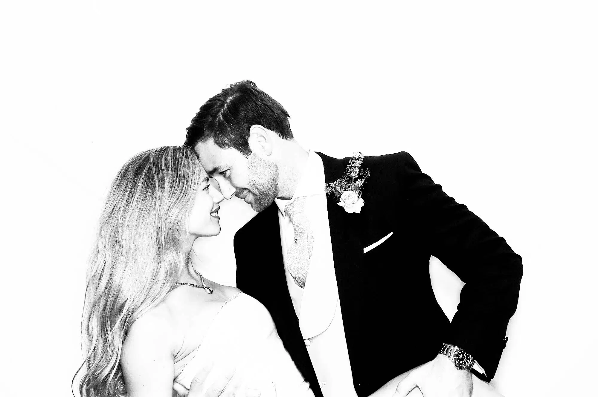 Bride and groom sharing a joyful portrait at the Signature GLAM Booth