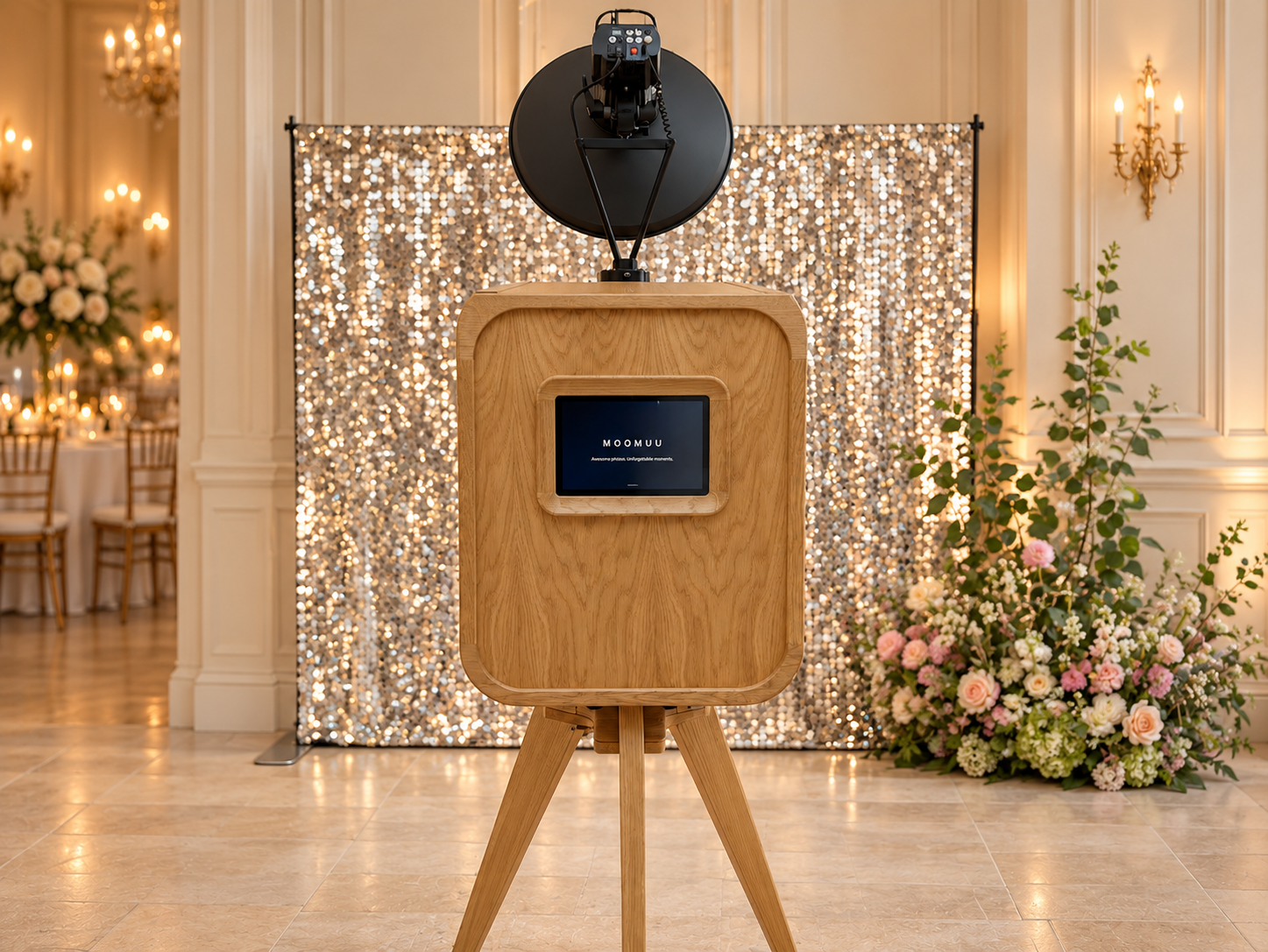 MooMuu Luxury Oak photo booth with studio lighting and a silver backdrop in an elegant venue.