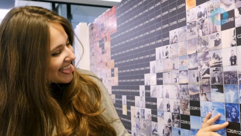 Wedding guests creating a MooMuu Photo Mosaic Wall