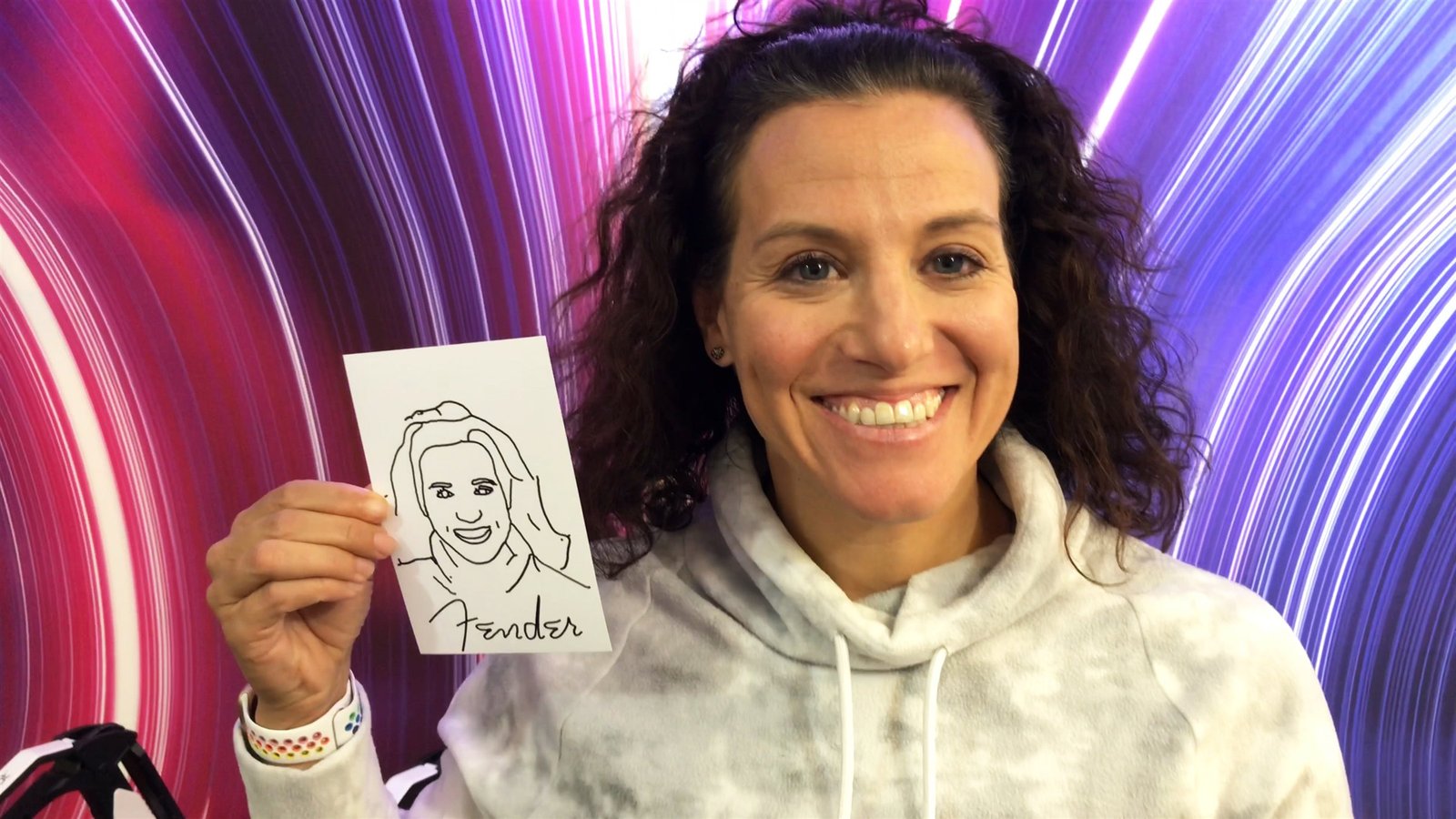 Guest holding her personalised portrait created by MooMuu AI Sketch Bot.