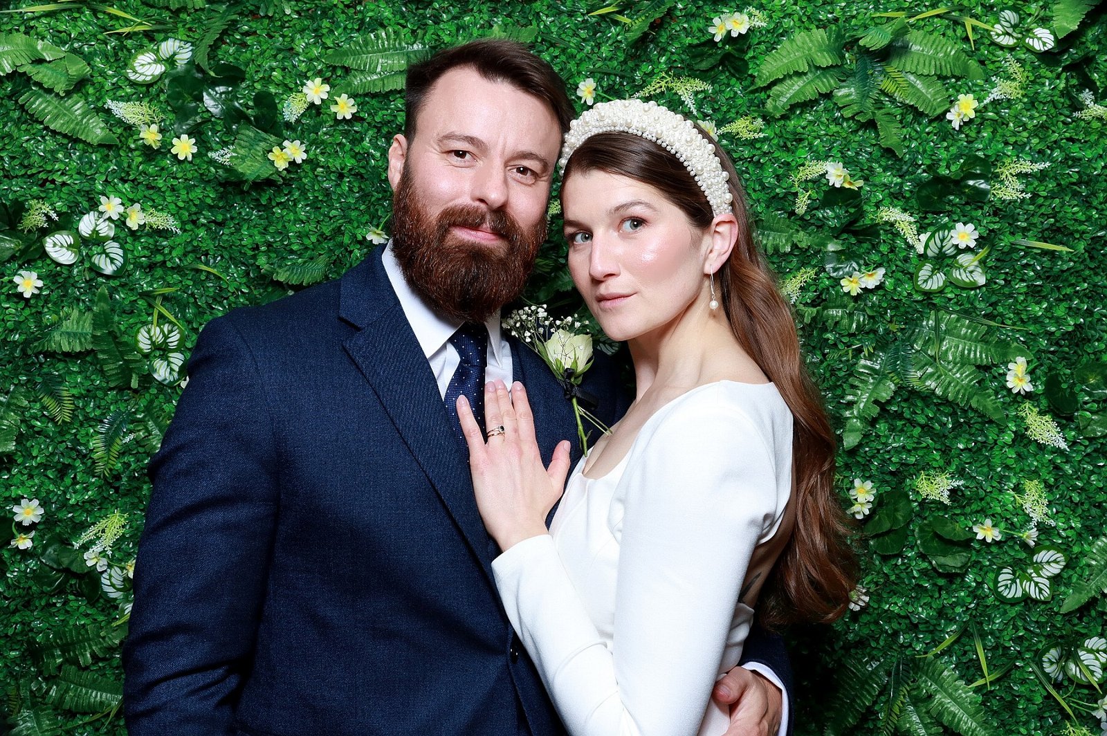 Wedding couple photographed by MooMuu at Syrencot against a green foliage backdrop