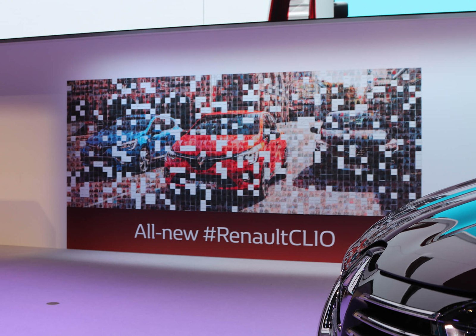 Large physical photo mosaic featuring three Renault cars, with some photo-tile spaces still unfilled.